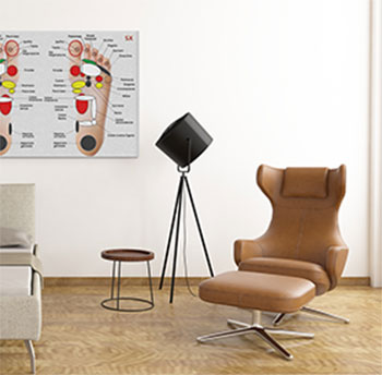 Mappa di riflessologia plantare appesa in studio